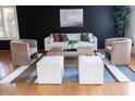 Stylish living room featuring neutral furnishings and a modern accent wall at 288 E Baylor Ln, Gilbert, AZ 85296