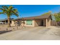 Single-story home with a carport and desert landscaping for low maintenance at 3 S 130Th Pl, Chandler, AZ 85225