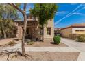Inviting two-story home featuring a stone-accented entryway and a well-maintained landscaped front yard at 3272 E Tyson St, Gilbert, AZ 85295