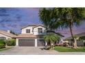 Charming home with a three-car garage, landscaped yard, and beautiful desert plants at 3411 S Vine St, Chandler, AZ 85248