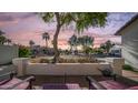 Inviting front porch with cozy chairs and views of the serene neighborhood lake at 3411 S Vine St, Chandler, AZ 85248