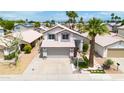 Aerial view of home highlighting the roof, front yard landscaping, and neighborhood at 3912 E Rockwood Dr, Phoenix, AZ 85050