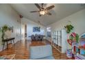 Spacious living area with ceiling fan, neutral colors, and ample natural light at 4350 E Abraham Ln, Phoenix, AZ 85050