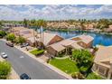 Stunning aerial view of a waterfront property with lush landscaping, private docks, and serene water views at 518 S Bay Shore Blvd, Gilbert, AZ 85233