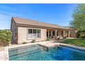 Home exterior showcasing pool with backyard and covered patio, great for outdoor living at 5813 E Ashler Hills Dr, Cave Creek, AZ 85331