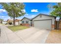 Street view of a well-kept single-Gathering home, including a two-car garage and a tree-lined street at 6335 E Brown Rd # 1084, Mesa, AZ 85205