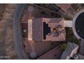Bird's-eye view of a home with solar panels and desert landscaping at 7659 S 164Th Ln, Goodyear, AZ 85338
