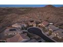 Aerial view of a desert neighborhood featuring single-Gathering homes on a cul-de-sac at 7659 S 164Th Ln, Goodyear, AZ 85338