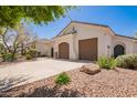 Charming single-story home offers a spacious private garage, low-maintenance landscaping, and a welcoming facade at 815 W Juniper Ln, Litchfield Park, AZ 85340