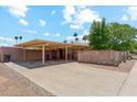 Large carport and driveway, providing ample parking space with a block wall for privacy at 8202 E Coolidge St, Scottsdale, AZ 85251