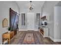 Bright foyer featuring a rustic sliding barn door and stylish decor at 8654 W Melinda Ln, Peoria, AZ 85382