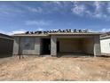 New home under construction showing the facade and a covered car port with a stacked tile roof and a blue sky background at 9540 W Parkway Dr, Tolleson, AZ 85353