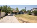 A single Gathering home with a large, fenced front yard and a concrete patio space at 1108 S Lebanon Ln, Tempe, AZ 85288