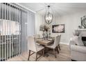 Chic dining area features stylish light fixture, seating for six, and modern decor at 15252 N 100Th St # 1154, Scottsdale, AZ 85260