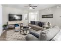 Comfortable living room with hardwood floors, a ceiling fan, and plenty of seating at 15252 N 100Th St # 1154, Scottsdale, AZ 85260