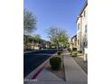 A well-maintained street with sidewalks, trees, and appealing two-story homes in a residential community at 34940 N 30Th Ave, Phoenix, AZ 85086
