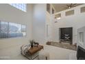 Spacious living room with a neutral color palette and natural light at 43324 W Desert Fairways Dr, Maricopa, AZ 85138