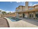 Serene backyard pool and covered patio provide a relaxing waterside experience at 514 E Vaughn Ave, Gilbert, AZ 85234