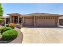 Attractive single-story home featuring a three-car garage and desert landscaping at 10903 E Ocaso Ave, Mesa, AZ 85212