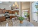 The kitchen features stainless steel appliances, granite counters, and an eat-in kitchen at 1562 E Gleneagle Dr, Chandler, AZ 85249