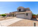 Two-story home featuring neutral paint, tile roof, and a spacious two-car garage with low maintenance landscaping at 15808 N 164Th Ln, Surprise, AZ 85388