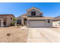 Two-story home featuring neutral paint, tile roof, and a spacious two-car garage and low maintenance desert landscaping at 15808 N 164Th Ln, Surprise, AZ 85388