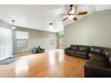Spacious living room with vaulted ceiling, wood floors, and natural light at 20419 N 34Th St, Phoenix, AZ 85050