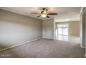 Inviting living room featuring neutral paint, carpeted floors, and bright, natural light at 2110 E Kathleen Rd, Phoenix, AZ 85022