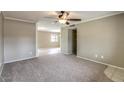 Inviting living room featuring neutral paint, carpeted floors, and bright, natural light at 2110 E Kathleen Rd, Phoenix, AZ 85022
