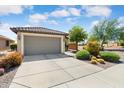 Gorgeous home with two car garage, neutral color scheme, desert landscaping and beautiful curb appeal at 21573 N 261St Ave, Buckeye, AZ 85396