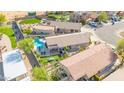 Aerial view of a house with a private pool and backyard at 21605 N 48Th Pl, Phoenix, AZ 85054