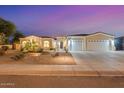 Charming single-Gathering home with a three-car garage and professionally landscaped front yard at 3125 W Desert Ln, Laveen, AZ 85339