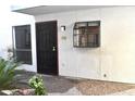 Charming entryway with a black door and decorative window at 3420 W Danbury Dr # C130, Phoenix, AZ 85053