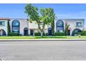 Inviting townhome exterior featuring mature trees, well-maintained landscaping, and lovely architectural details at 3820 N 30Th St, Phoenix, AZ 85016
