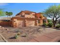 Beautiful two-story home showcasing a three-car garage and desert landscaping at 4055 N Recker Rd # 71, Mesa, AZ 85215