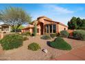 Well-maintained home with lush landscaping, desert plants and mature trees at 4055 N Recker Rd # 71, Mesa, AZ 85215