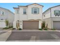 Charming two-story home featuring a brown two-car garage and manicured landscaping at 4803 S Ferric --, Mesa, AZ 85212