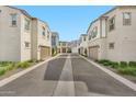 Exterior street view of modern townhomes in a well-maintained community at 4803 S Ferric --, Mesa, AZ 85212
