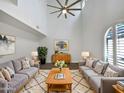 Bright, modern living room with vaulted ceilings, contemporary decor, and large arched window at 5015 E Cheyenne Dr # 14, Phoenix, AZ 85044