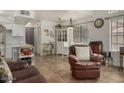 Open living area features tile floors, natural light, and comfortable leather furniture at 602 N May St # 65, Mesa, AZ 85201