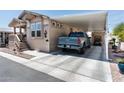Charming single-story home with covered parking and low-maintenance landscaping at 9333 E University Dr # 194, Mesa, AZ 85207