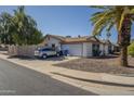 Spacious single-story home featuring an attached garage and low-maintenance desert landscaping at 12154 S Ki Rd, Phoenix, AZ 85044