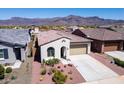 Charming single-story home featuring desert landscaping and a two-car garage at 12538 E Pivot Peak --, Gold Canyon, AZ 85118