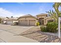 Inviting single-Gathering home with a two-car garage, desert landscaping, and welcoming front entrance at 1413 E San Remo Ave, Gilbert, AZ 85234