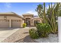 Charming home with a well-manicured front yard and two-car garage at 1413 E San Remo Ave, Gilbert, AZ 85234