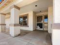 Covered front porch with a security screen door and decorative columns for added curb appeal at 17210 N Cassi Dr, Surprise, AZ 85374