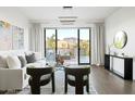 Stylish living room featuring comfortable seating, outdoor views, and modern furnishings at 2300 E Campbell Ave # 106, Phoenix, AZ 85016