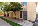 Charming two-story home with well-maintained landscaping, offering inviting curb appeal at 2431 E Tracy Ln # 1, Phoenix, AZ 85032