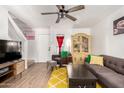 Comfortable living room with a decorative rug, modern furniture, and bright natural light at 2431 E Tracy Ln # 1, Phoenix, AZ 85032