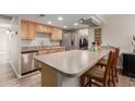 Bright kitchen featuring stainless steel appliances, breakfast bar, and modern cabinetry at 3526 N 85Th St, Scottsdale, AZ 85251